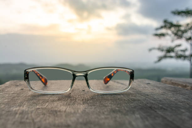 istock Eyeglasses on wooden table 984688976
