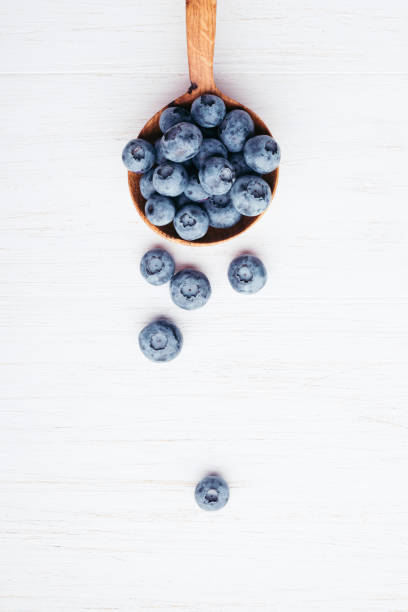 istock Bluberries in wooden spoon. 984689138