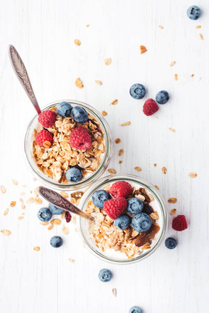 istock Granola with berries and yogurt in jars. 984689490