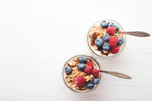 istock Granola with berries and yogurt in jars. 984689504