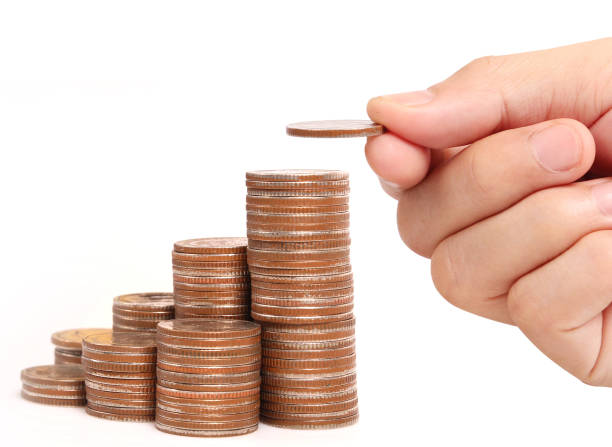 istock money growing from coins in hand 984698288