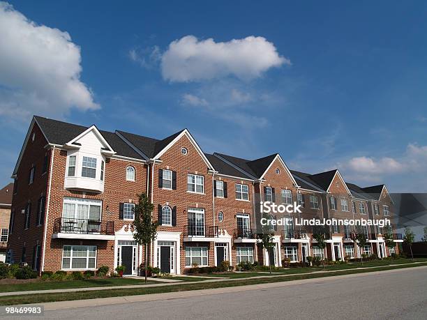 Row Of Brick Condos With Bay Windows Stock Photo - Download Image Now - Rooftop, Townhouse, Brick