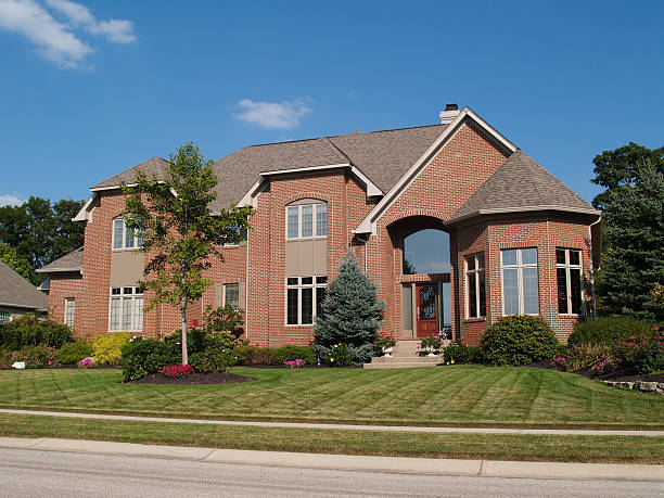 istock Large Two Story New Brick Home With Turret 98470030