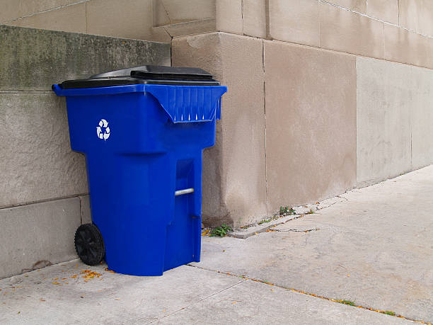 istock Large Blue Trash Can on a City Sidewalk 98470042