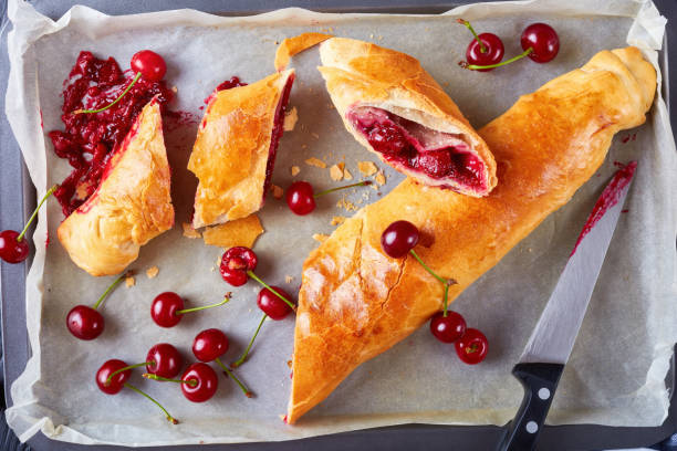 istock freshly baked cherry strudel cut in slices 984702656