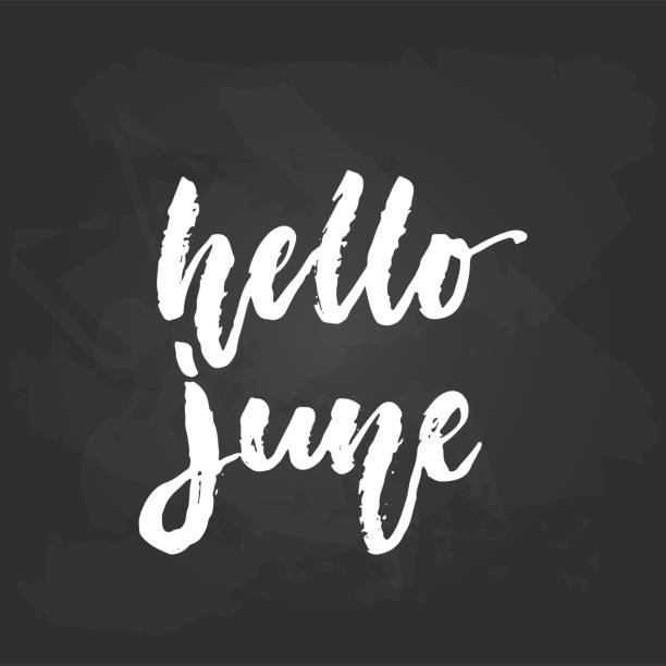istock Hello, June - hand drawn seasons holiday lettering phrase isolated on the black chalkboard background. Fun brush ink vector illustration for banners, greeting card, poster design. 984711784