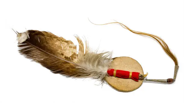 Photo of Eagle feather with horse hair as Indian hair ornament optional on white