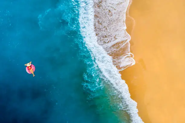 Aerial view of swimming in clear turquoise water. Mediterranean sea.