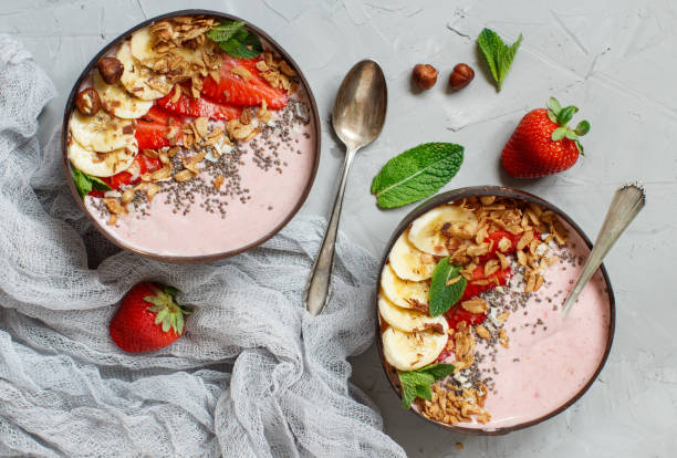istock Strawberry and banana smoothie bowls 984728842