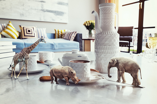 tiny african animals on the coffee table. Photo elements and 3d rendering combination. Grain and texture added
