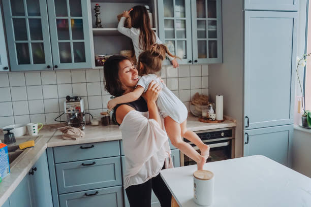 istock Happy family having fun in the kitchen 984735424