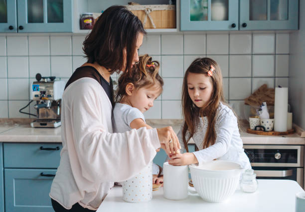istock Happy family cook together in the kitchen 984735562