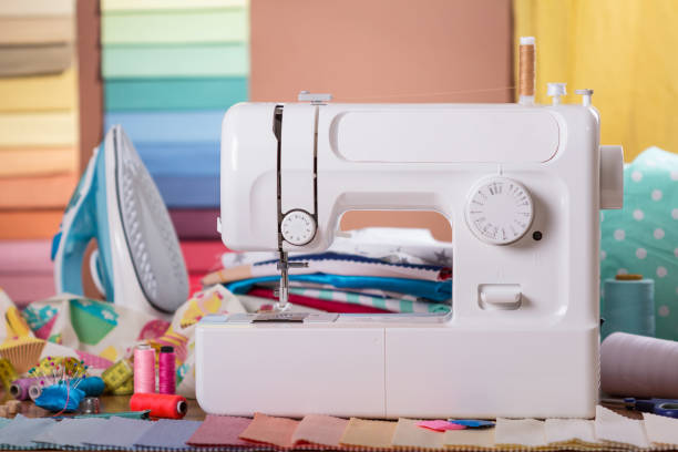 istock Sewing machine, sewing accessories and samples of fabric 984738410