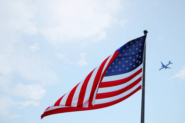 istock American flag on the blue sky 984738830