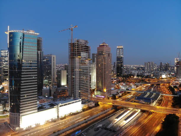 istock Modern future cityscape skyscraper skyline aerial view night 984745940