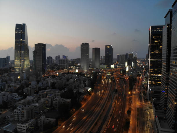 istock Modern future cityscape skyscraper skyline aerial view night 984746020
