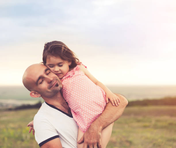 istock Father and daughter hugging on summer sunset 984752768