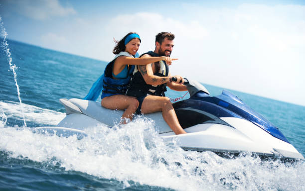 jet skiing. - nautical vessel motorboating motorboat fun imagens e fotografias de stock