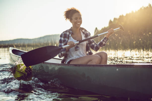 istock Young Woman Canoeing on the Lake 984757878