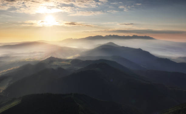 istock Mountain silhouette at sunset in Tatras, Slovakia 984758024
