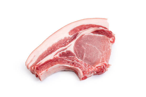 istock Uncooked pork loin chop bone on a white background 984761542