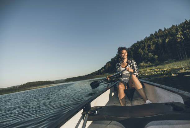 istock Young Woman Canoeing on the Lake 984767138