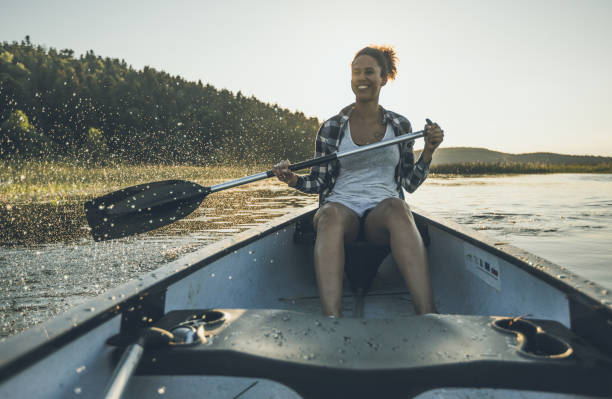 istock Young Woman Canoeing on the Lake 984767168
