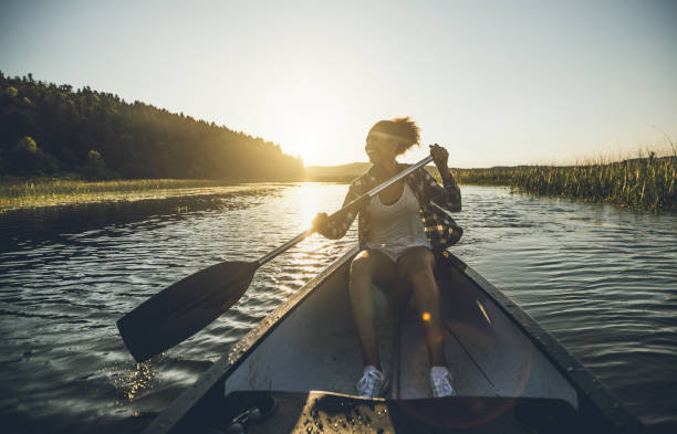 istock Young Woman Canoeing on the Lake 984767216