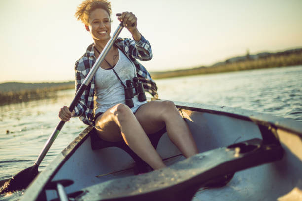 istock Young Woman Canoeing on the Lake 984767278