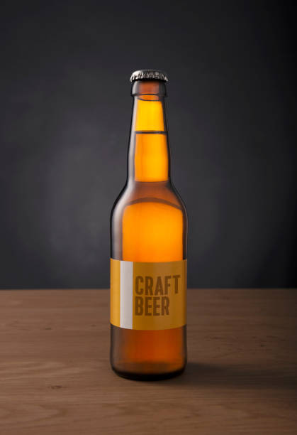 istock craft beer bottle with custom made label on the table against black background 984775896