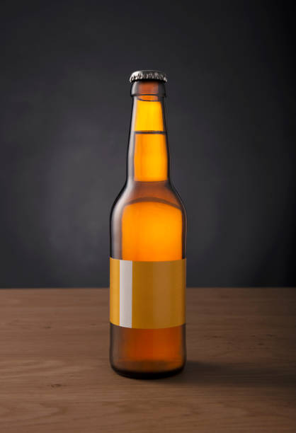 istock craft beer bottle with blank custom made label on the table against black background 984775898
