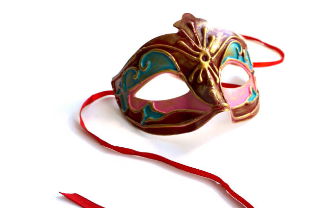 istock Red and gold carnival mask with satin ribbons. 984787570