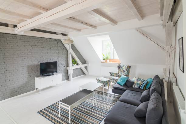 istock Bright modern living room with television set and fabric couch 984790678