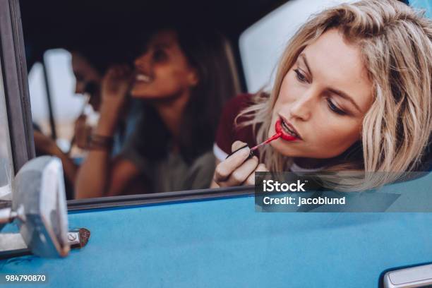 Women On Road Trip Doing Makeup In A Moving Car Stock Photo - Download Image Now - Make-Up, Lipstick, Women