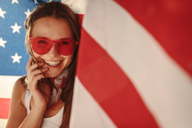 istock American girl with national flag 984793200