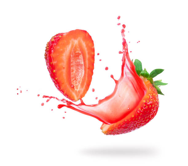 istock Strawberry cut into two halves with flowing juice close-up on white background 984797002