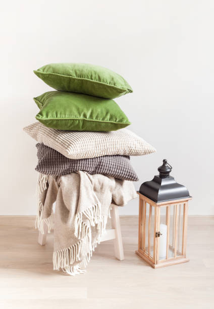 istock gray and green cushions, throw. cozy home 984802962