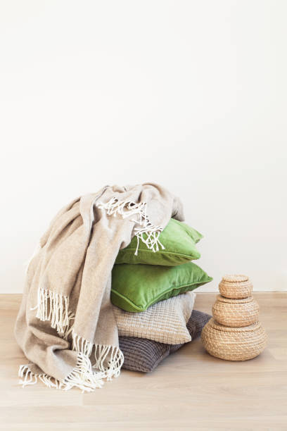 istock gray and green cushions, throw. cozy home 984803262