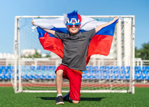istock Russian Boy is Young Soccer Fan 984824120