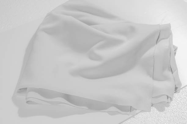 istock Texture. Background. Cloth - silk white. Delicate design in time for the season, take home this white swan. With its silky smooth hand and uplifting drapery, create soft silhouettes that boast of luxury 984825652