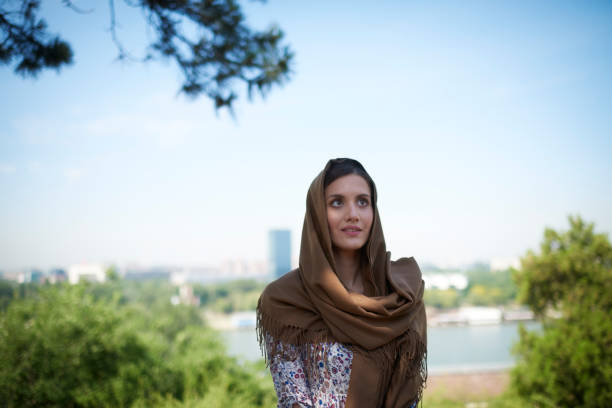 Portrait of young woman with headscarf somewhere in the city.