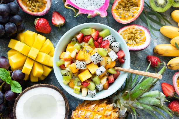 istock Tropical fruit salad with mango and pitaya in bowl 984844438