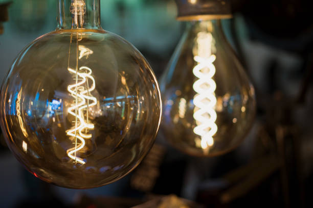 istock Vintage light bulbs in a dark interior. 984844584