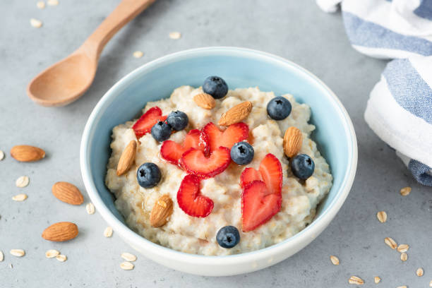 istock Oatmeal porridge bowl with berries and nuts 984844590
