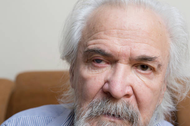 istock Lonely old man with sore eyes 984845600