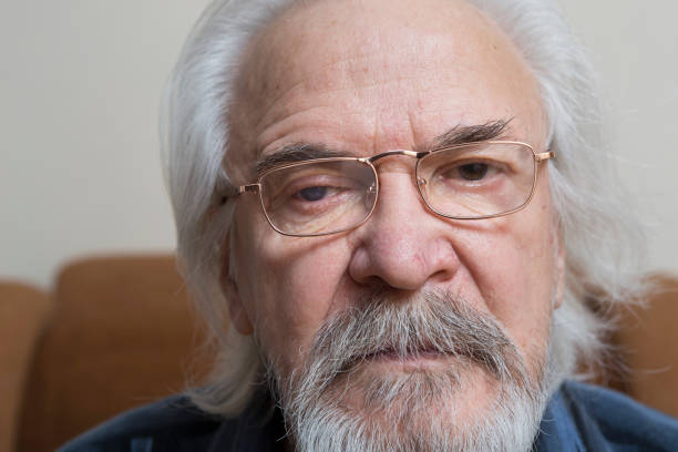 istock Lonely old man with sore eyes 984846144