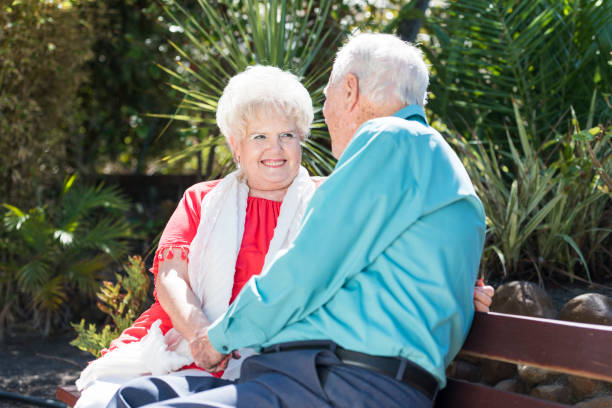 istock Senior couple sitting on a bench 984846188