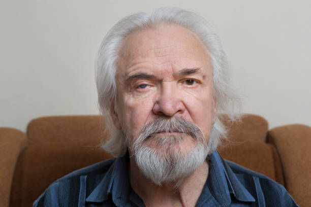 istock Lonely old man with sore eyes 984846304