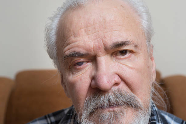 istock Lonely old man with sore eyes 984846328