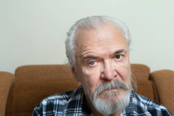 istock Lonely old man with sore eyes 984846450